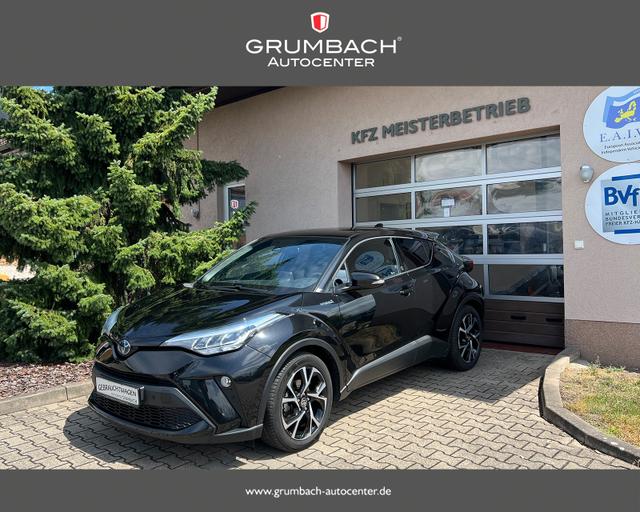 Gebrauchtfahrzeug Toyota C-HR - 2.0 Hybrid 135kw, Team Deutschland Bi-LED Sitzh. Lenkr.hzb. SideAssist 18Zoll SafetySense Kamera