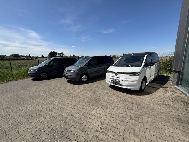 Volkswagen T7 California Ocean 2.0 TDI 150PS DSG, 16" Alu, ELEKTRISCHES Aufstelldach, Privacy-Glas, Climatronic, KÜCHE, Standheizung + FB, Sitzheizung, Park Assist, Parksensoren v/h, Kamera, IQ Light LED-MATRIX, Markise, Side ACC, Ganzjahresreifen, Radio 10" App-Connect 