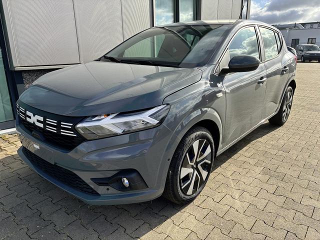 Dacia Sandero - Expression 1.0 ECO-G 100 BENZIN/LPG-GASANLAGE, SONDERLACKIERUNG URBAN-GRAU, Klimaanlage, NAVIGATIONSSYSTEM 8", Parksensoren VORNE + HINTEN, RÜCKFAHRKAMERA, TOTER-WINKEL-WARNER, Nebelscheinwerfer, Tempomat, Lederlenkrad, Armlehne, Spiegel elektr. einstell-/beheizbar