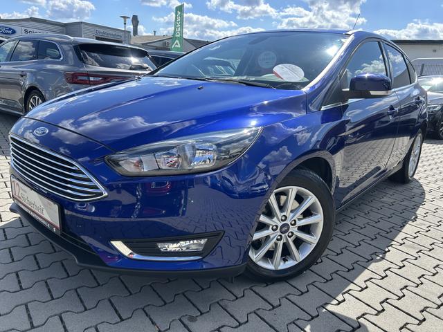 Ford Focus - 1.5 EcoBoost Titanium*SITZHEIZUNG*ABS*USB*LENKRAD BHEIZBAR*ESP*SERVICE NEU*GARANTIE*FRONTSCHEIBE BEHIZBAR*MULTIFUNKTIONSLENKRAD*START/STOP AUTOMATIK*5 GANG*KLIMAAUTOMATIK 2 ZONEN*HECKLEUCHTEN LED*TAGFAHRLICHT LED*SPORTSITZE VORNE*TEMPOMAT*SICHT-PAKE
