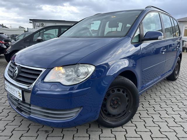Volkswagen Touran - 1.4 TSI Trendline*7 SITZER*ANH&Auml;NGERKUPPLUNG*T&Uuml;V NEU*8XREIFEN*SCHECKHEFTGEPFLEGT*KLIMA*6 GANG*CD-PLAYER*ABS*ESP*METALLIC-LACKIERUNG*AUTOMATISCHE FAHRLICHTSCHALTUNG*SCHEINWERFER-REINIGUNGSANLAGE*SERVOLENKUNG ELEKTR. GESTEUERT*RADIO*WEGFAHRSPERRE*