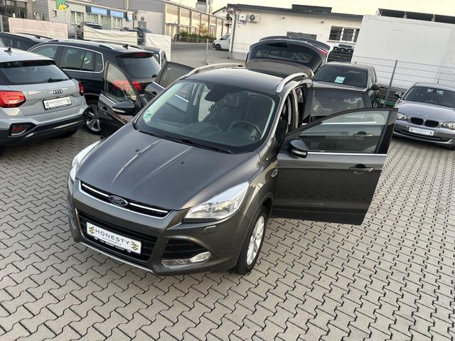 Ford Kuga 1.5 EcoBoost 4x4 Titanium*AUTOMATIK*DACHRELING*SITZHEIZUNG*NAVIGATION*EURO 6*TAGFAHRLICHT*AABS*ASR*AUDIOBEDIENUNG AM LENKRAD*EBD*ESP*KLIMAAUTOMATIK 2 ZONEN*LENKRAD LEDER*4 SPEICHEN*FRONTSCHEIBE BEHEIZBAR*SPORTSITZE VORN*ALLRADANTRIEB*WINTER-PAKET*AUX-IN* 