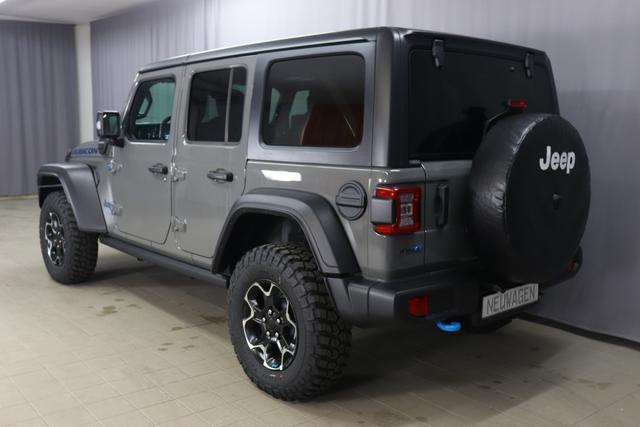 "2.0 4xe Rubicon Plug-In Hybrid 280 (380) 8-Stufen- Automatikgetriebe"PDN Sting Gray 1AL + 211 Leder schwarz "OZT+LMS Sicherheits-Paket 211+JPM Sitzbezüge in Leder² inklusive Sitzheizung vorn AAN Technologie-Paket AD6 LED Lightning Group mit LED-Hauptscheinwerfer, AHT/ ADH Lichtmaschine / Batterie mit erhöhter Kapazität (240 Ampere / 700 Ampere) AFB Dachhimmel mit zusätzlicher Geräuschdämmung LSB Alarmanlage CWA MOPAR® Allwetter-Fußmatten HT1 Freedom Hardtop XNY Integrierte Offroad-Kamera vorne RDG GLOBAL TELEMATICS BOX MODULE (TBM) AEN Dual Top in schwarz (Freedom® Hard Top in schwarz und Sunrider® Soft Top in schwarz) XC3 MOPAR® Haltegriffe Wrangler (Innenraum) RTR E Call SOS klic"