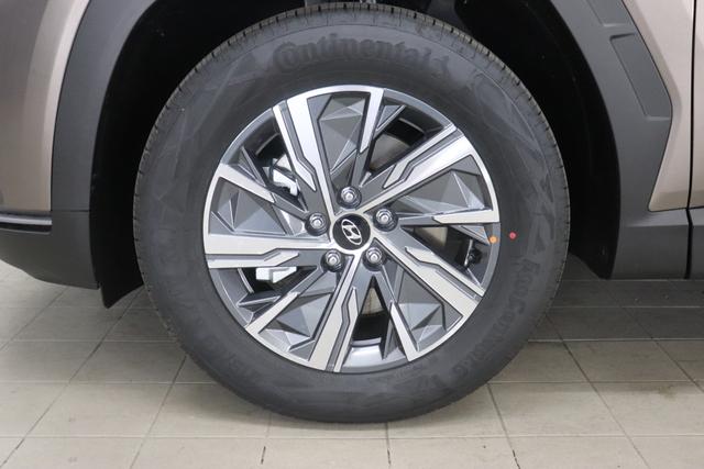 Hyundai Tucson 1.6 T-GDI 6MT 2WD Family MY23 110kW Silky Bronze Sitzpolsterung in Stoff Schwarz