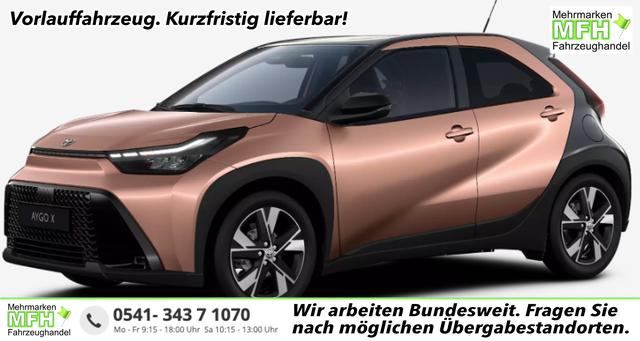 Toyota Aygo X - Pulse 1.5 Hybrid 115PS CVT/AUTOMATIK, 3 Jahre Garantie, 17" Alufelgen, Cinnamon-Metallic/Dach schwarz, Privacy-Glas, Sitzheizung, R&uuml;ckfahrkamera, Klimaautomatik, Audiosystem 9" + Smartphone-Integration, Lederlenkrad, ACC, ZV mit Fernbedienung, LED-Scheinwerfer