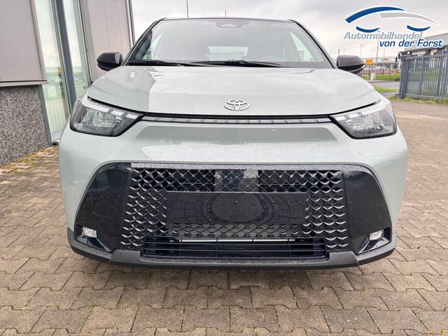 Toyota Aygo X "Envy / EU-Lounge" LIEFERUNG KOSTENLOS! 1.5 Hybrid 115PS CVT/AUTOMATIK, 3J Garantie, 18" Alu, FALTDACH, Smart Entry, Dach schwarz, Privacy-Glas, Sitzheizung, Parksensoren v/h, R&uuml;ckfahrkamera, 2-Zonen-Klimaautomatik, Audiosystem 10,5" + Cloud-NAVI, Lederlenkrad, ACC, LED-Scheinwerfer, JBL-SOUND 