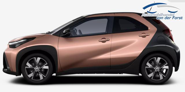 Toyota Aygo X "Pulse / EU-Teamplayer" LIEFERUNG KOSTENLOS! 1.5 Hybrid 115PS CVT/AUTOMATIK, 3 Jahre Garantie, 17" Alufelgen, Cinnamon-Metallic/Dach schwarz, Privacy-Glas, Sitzheizung, R&uuml;ckfahrkamera, Klimaautomatik, Audiosystem 9" + Smartphone-Integration, Lederlenkrad, ACC, ZV mit Fernbedienung, LED-Scheinwerfer 