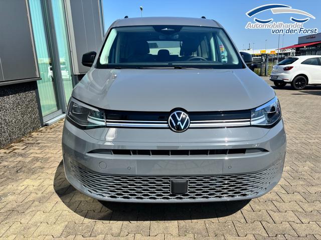 Volkswagen Caddy MAXI (NEUES MODELL) - BEHINTERTENUMBAU "Style" (NEUES MODELL) PREISGARANTIE & KOSTENLOSE LIEFERUNG 1.5 TSI 115PS DSG (MAXI, LANGER RADSTAND), 17" Alu, Beh. Frontscheibe, Sitzheizung, Keyless, Privacy-Glas, Alarm, ParkAssist, Parksensoren vorn/hinten, R&uuml;ckfahrkamera, Dachreling, ACC, 2Z-Climatronic, Radio 12,9/AppConnect, LED-Scheinwerfer 