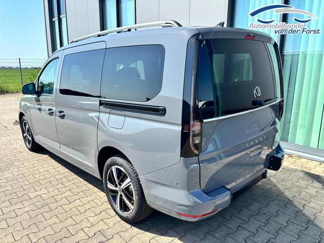 Volkswagen Caddy MAXI (NEUES MODELL) - BEHINTERTENUMBAU "Style" (NEUES MODELL) PREISGARANTIE & KOSTENLOSE LIEFERUNG 1.5 TSI 115PS DSG (MAXI, LANGER RADSTAND), 17" Alu, Beh. Frontscheibe, Sitzheizung, Keyless, Privacy-Glas, Alarm, ParkAssist, Parksensoren vorn/hinten, R&uuml;ckfahrkamera, Dachreling, ACC, 2Z-Climatronic, Radio 12,9/AppConnect, LED-Scheinwerfer 