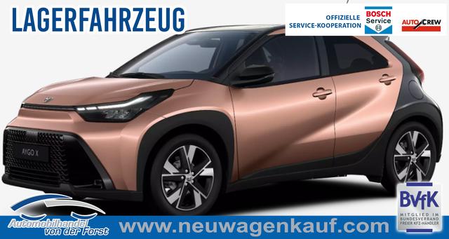 Toyota Aygo X - "Pulse / EU-Teamplayer" LIEFERUNG KOSTENLOS! 1.5 Hybrid 115PS CVT/AUTOMATIK, 3 Jahre Garantie, 17" Alufelgen, Cinnamon-Metallic/Dach schwarz, Privacy-Glas, Sitzheizung, R&uuml;ckfahrkamera, Klimaautomatik, Audiosystem 9" + Smartphone-Integration, Lederlenkrad, ACC, ZV mit Fernbedienung, LED-Scheinwerfer