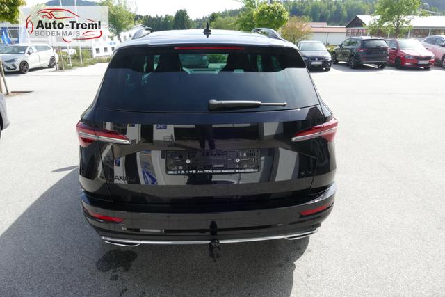 Skoda Karoq Sportline 2.0 TSI DSG 190 PS 4x4 5JG AHK Navi 19" Alu beh.WS. SHZvo+hi Kamera PCDvo+hi variabler Ladeboden 