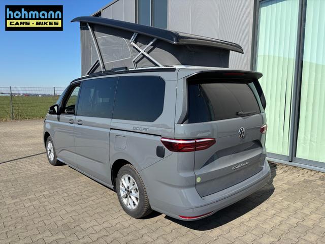 Volkswagen T7 California Ocean 2.0 TDI 150PS DSG, 16" Alu, ELEKTRISCHES Aufstelldach, Privacy-Glas, Climatronic, KÜCHE, Standheizung + FB, Sitzheizung, Park Assist, Parksensoren v/h, Kamera, IQ Light LED-MATRIX, Markise, Side ACC, Ganzjahresreifen, Radio 10" App-Connect 