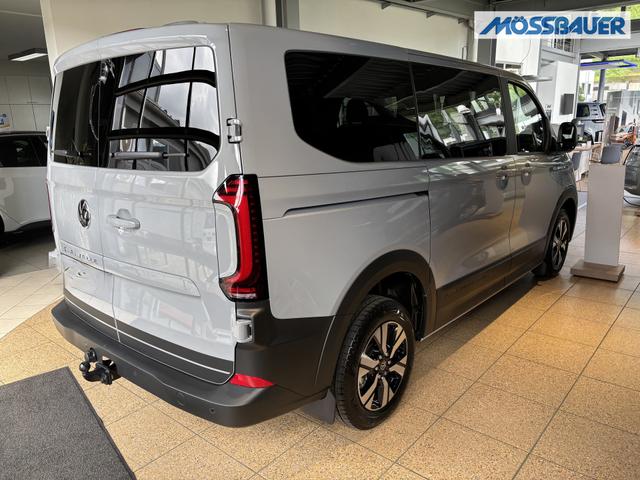 Volkswagen T7 Caravelle PanAmericana 2.0 TDI 150PS LANGER RADSTAND, 8-Sitzer, 17" Alu, NAVIGATION 13", Sitzheizung, M-Lederlenkrad, LED-Scheinwerfer, 3-Zonen-Climatronic, Parksensoren vorn/hinten, Rückfahrkamera, Privacy-Glas, Tempomat, Digitales Cockpit 