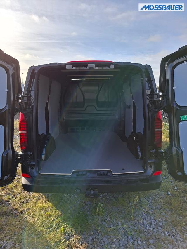 Volkswagen T7 Kastenwagen Basis 2.0 TDI 150PS AUTOMATIK, SCHWARZ-MET, HECKFLÜGELTÜREN, 2-Zonen-Klimautomatik, M-Lederlenkrad, Anhängerkupplung, Parksensoren vorn/hinten, Rückfahrkamera, Frontscheibe beheizbar, Ganzjahresreifen, Sitzpaket 46 (inkl. Sitzheizung), Reserverad, 70 Liter 