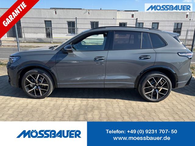 Volkswagen Tiguan - R-Line 2.0 TDI 4MOTION 193PS DSG, Grau-Metallic, PANORAMADACH, ANHÄNGERKUPPLUNG, IQ LIGHT, DESIGN-PAKET Black&Style, NAVI, DCC-Fahrwerk, 20" LEEDS schwarz, Area View, Alarm, Elektr. Heckklappe, Keyless,Massagefunktion, Park Assist, ACC, Sitzheizung, Climatronic