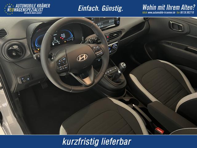 Hyundai i10 - GO+ 1.2 MT 58 kW (79 PS) Klimaautomatik, Navigationssystem, Apple CarPlay & Android Auto, Sitzheizung, Lenkradheizung, Einparkhilfe hinten, R&uuml;ckfahrkamera, Privacy Glass, 15" Leichtmetallfelgen, uvm.